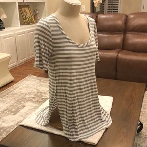 Grey/white striped t shirt; scoop neck & side vents with button details